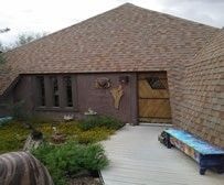 Modern brick house with wooden garage door